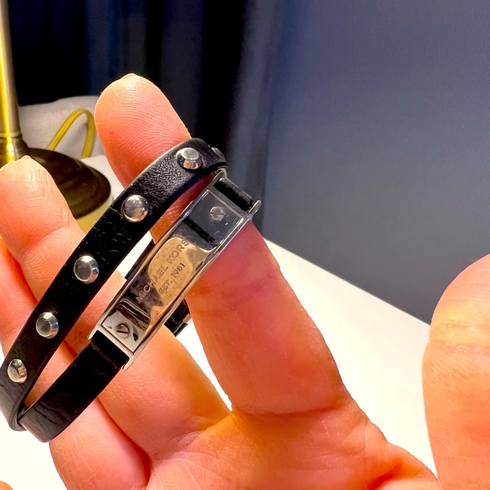 Micheal Kors bracelet w black leather band and gold studs